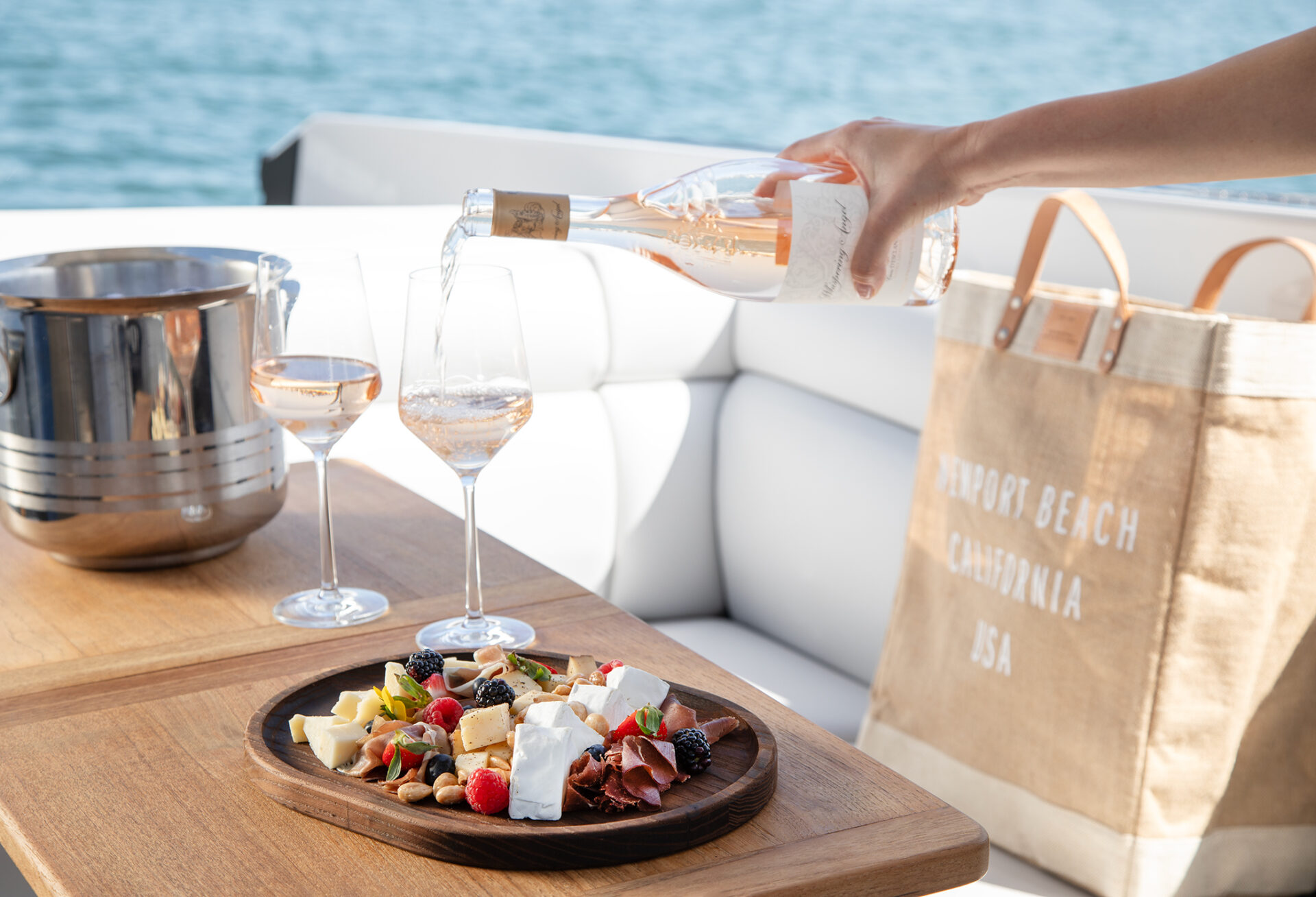 cheeseboard and wine aboard an Aviara private charter